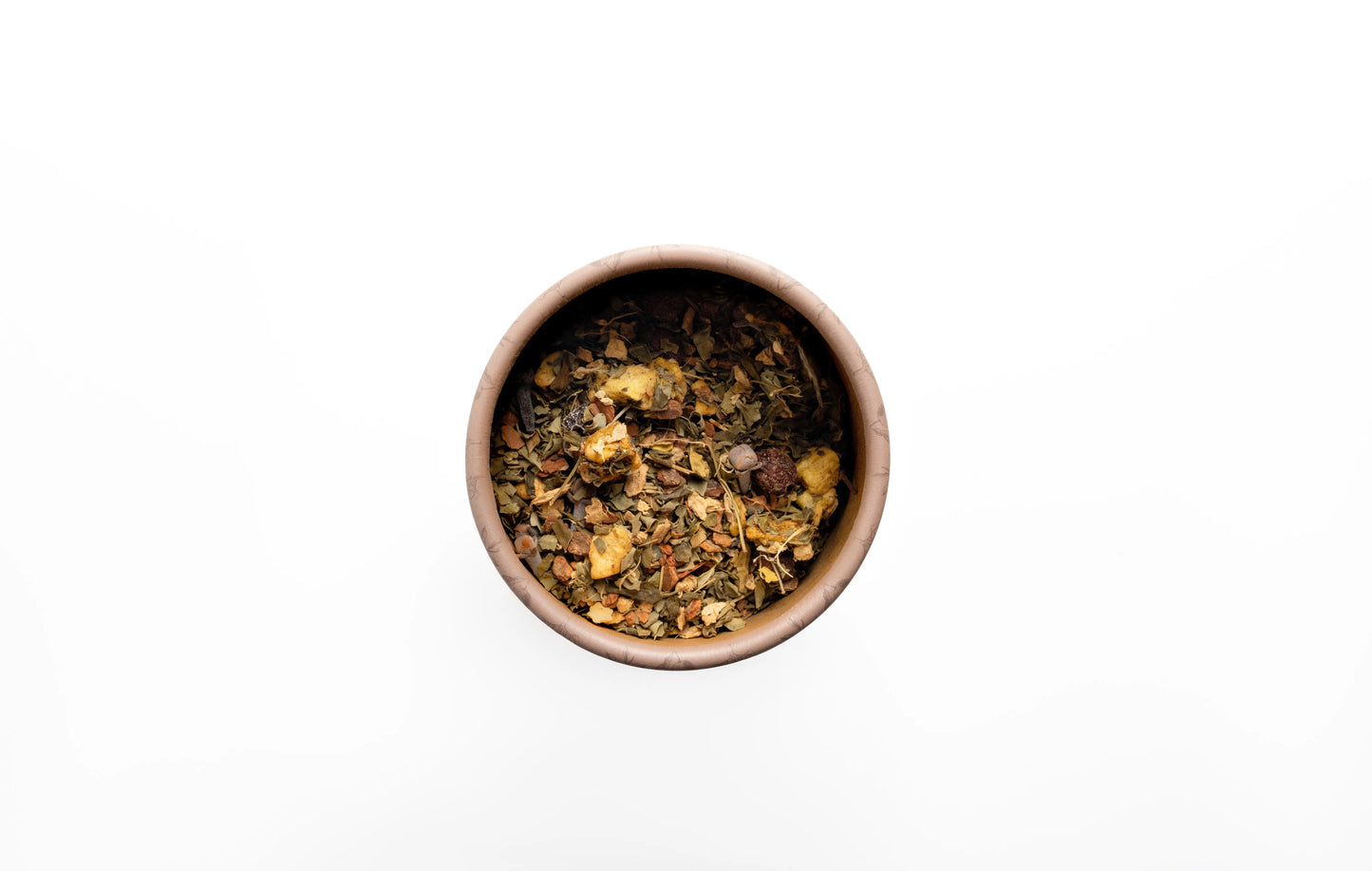 Small round bowl filled with organic loose leaf herbal tea blend.